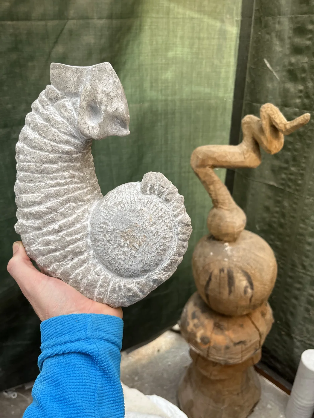 Shamir I during carving held in the artist's hand, showing its small scale